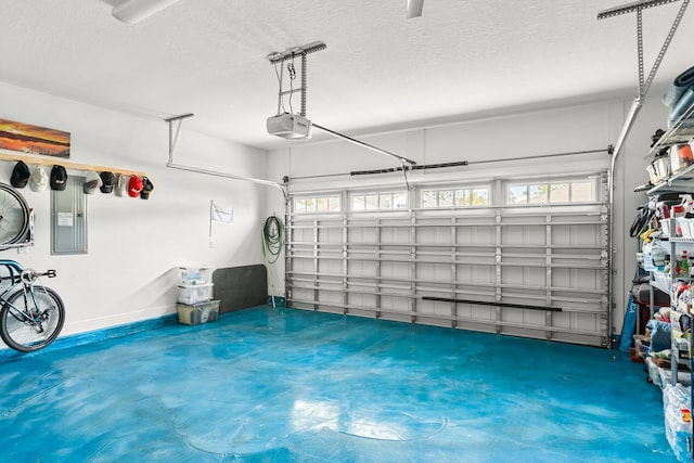 garage featuring a garage door opener and electric panel