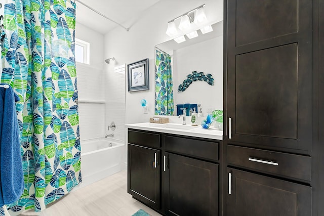 bathroom with vanity and shower / bath combination with curtain