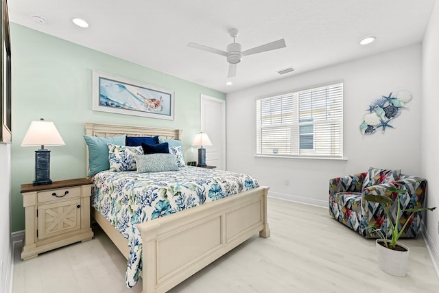 bedroom with light wood-type flooring and ceiling fan