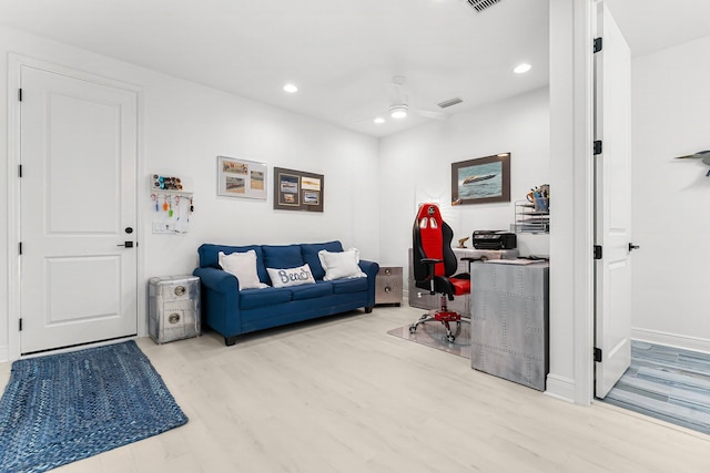 interior space featuring ceiling fan and light wood-type flooring