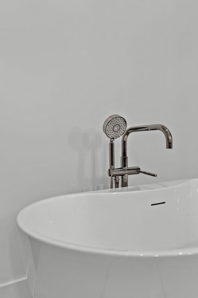 details with a bathing tub and sink