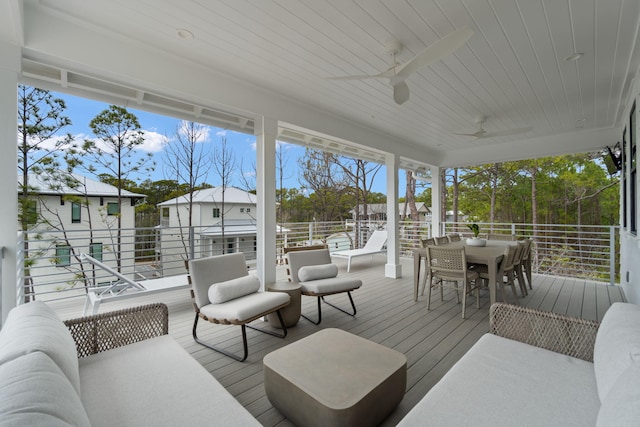 deck with ceiling fan and outdoor lounge area