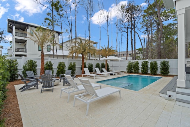 view of swimming pool featuring a patio area