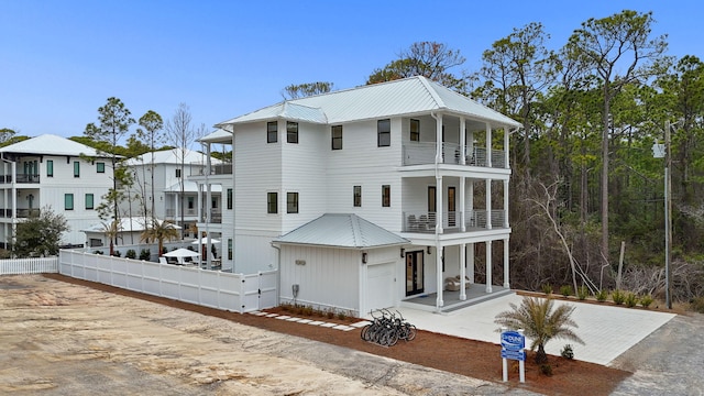 rear view of property with a balcony