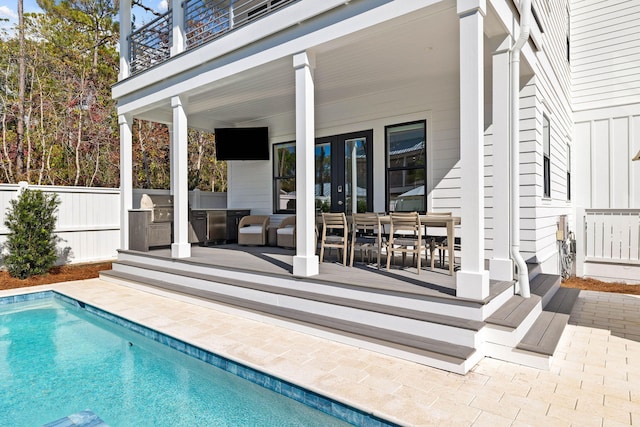 exterior space featuring a fenced in pool and a patio area