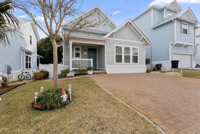 view of front of home featuring a front lawn and covered porch