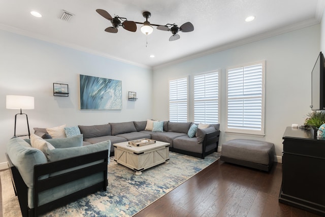 living room with crown molding, dark wood-type flooring, and ceiling fan