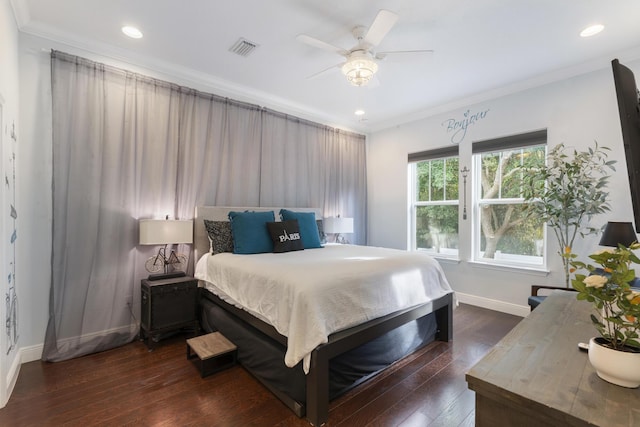 bedroom with ornamental molding, dark hardwood / wood-style flooring, and ceiling fan