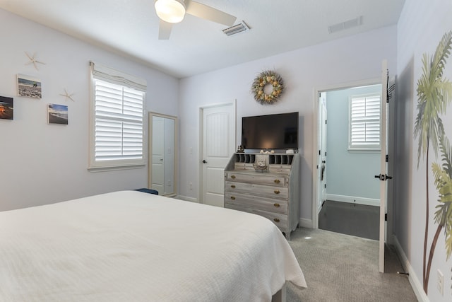 carpeted bedroom featuring ceiling fan