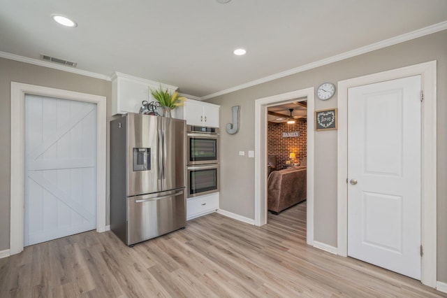 kitchen with stainless steel appliances, white cabinetry, light wood-type flooring, and crown molding