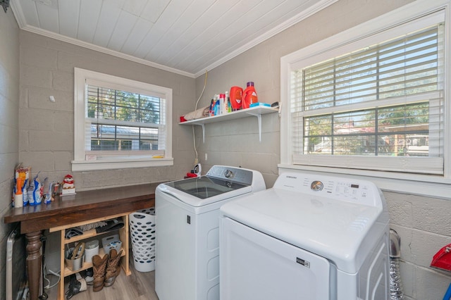 washroom with wood ceiling, crown molding, washing machine and dryer, and light wood-type flooring