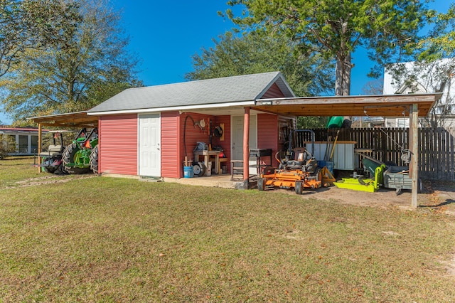 view of outbuilding featuring a yard