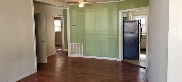 interior space featuring ornamental molding, dark hardwood / wood-style floors, and ceiling fan