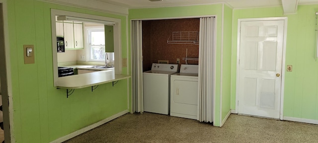 laundry room featuring sink and washing machine and clothes dryer