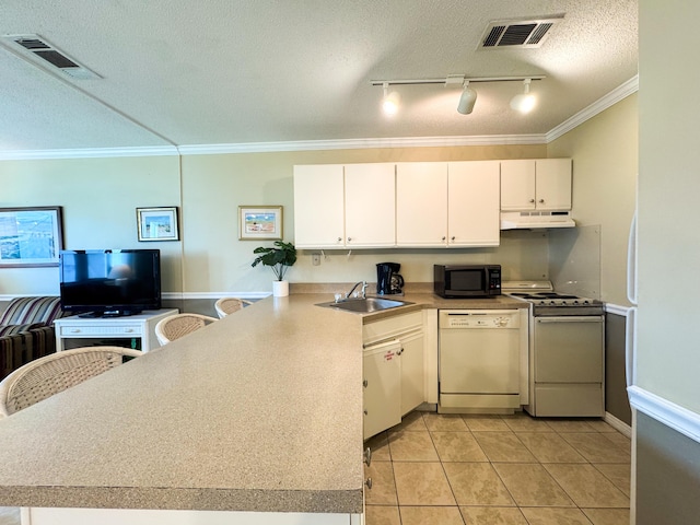 kitchen featuring sink, white cabinets, ornamental molding, kitchen peninsula, and white appliances