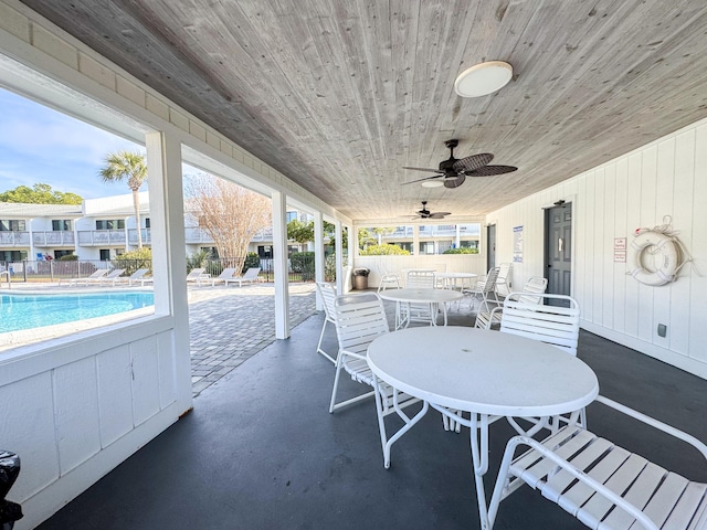 view of patio / terrace featuring a community pool and ceiling fan