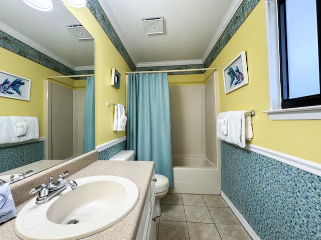 full bathroom with crown molding, a textured ceiling, vanity, shower / bath combo, and tile patterned flooring