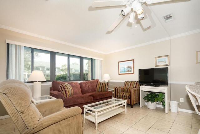 living room with ornamental molding, ceiling fan, and light tile patterned flooring