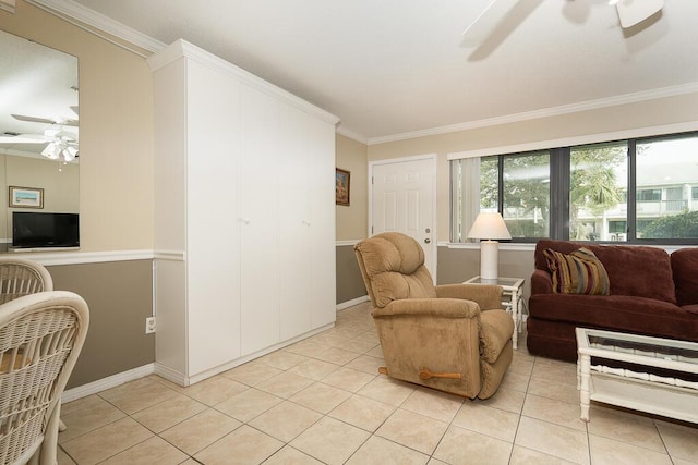 tiled living room featuring ornamental molding and ceiling fan