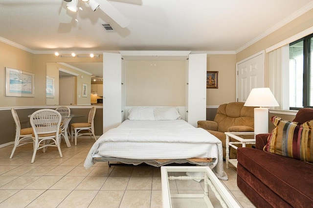 tiled bedroom with ceiling fan and ornamental molding