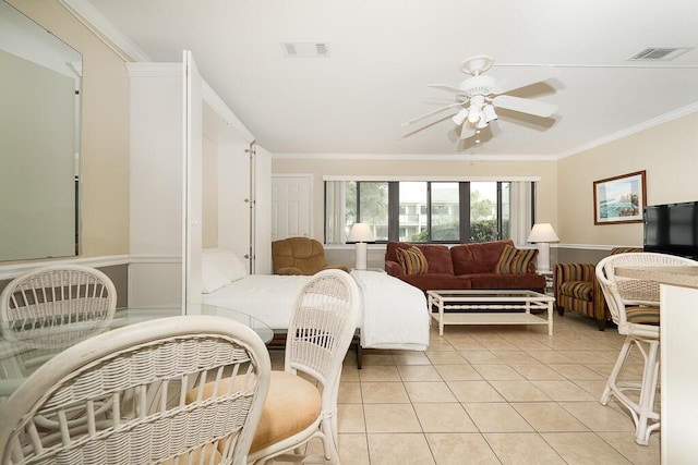 bedroom featuring crown molding, ceiling fan, and light tile patterned flooring