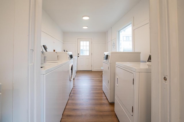 laundry area featuring independent washer and dryer and dark hardwood / wood-style floors