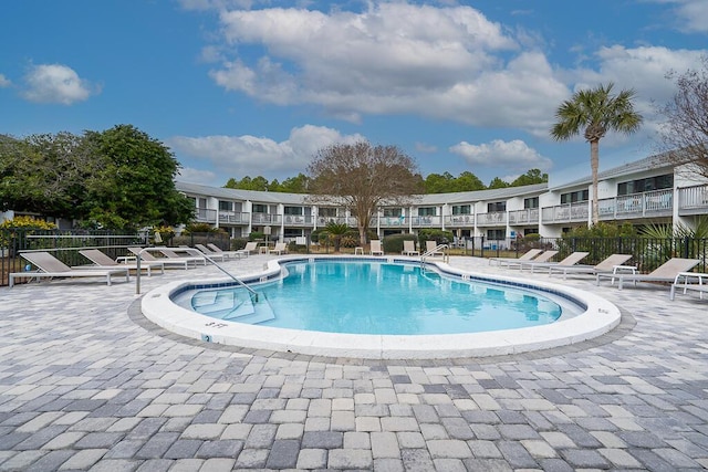 view of swimming pool featuring a patio