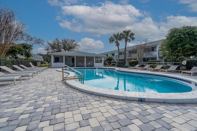 view of swimming pool with a patio