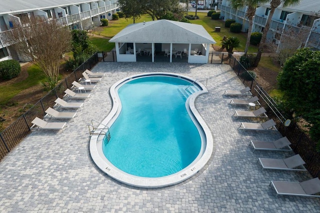 view of swimming pool with a patio area