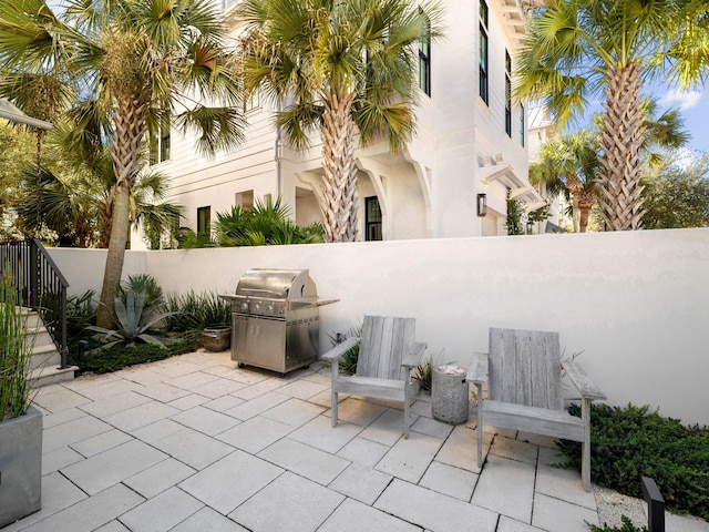 view of patio featuring a grill