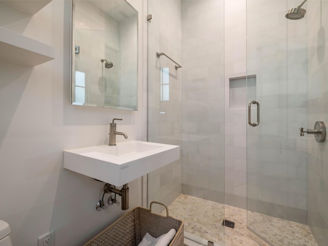 bathroom featuring sink and walk in shower