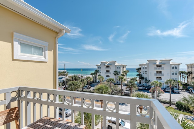 balcony featuring a water view