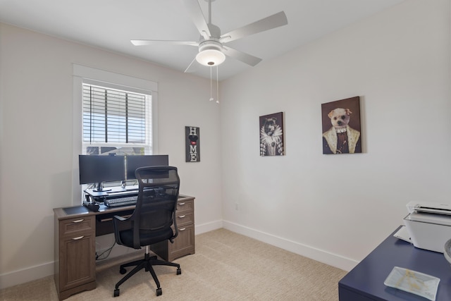 carpeted office space with ceiling fan