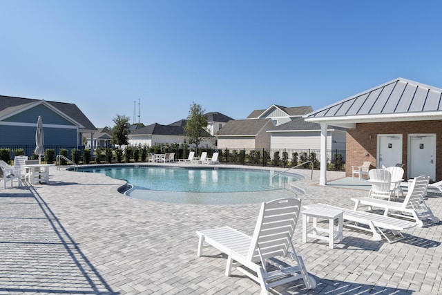 view of swimming pool featuring a patio area