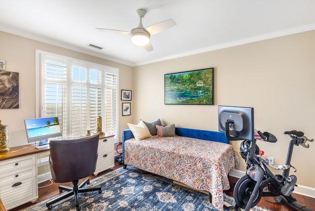 bedroom with crown molding and dark hardwood / wood-style floors