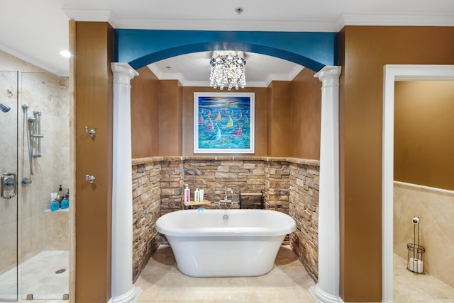 bathroom featuring tile walls, crown molding, plus walk in shower, and ornate columns