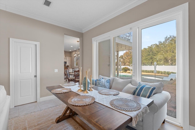 tiled dining area featuring ornamental molding