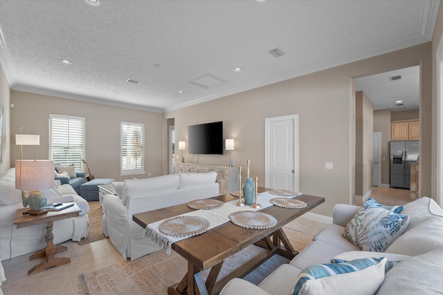 tiled living room featuring crown molding and a textured ceiling