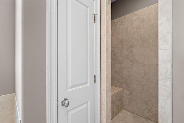 bathroom with tiled shower