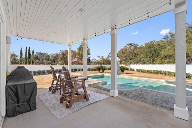 view of patio with a fenced in pool