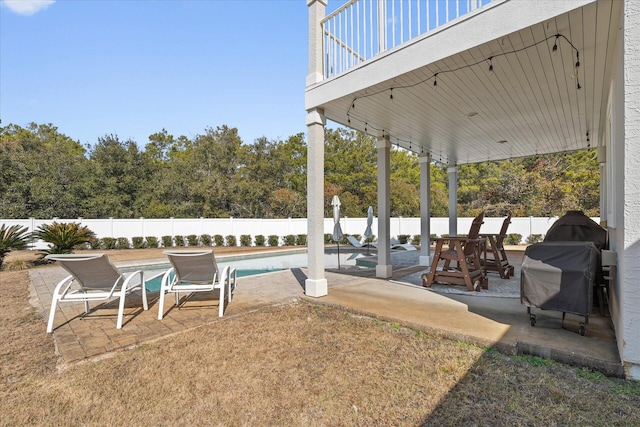 view of yard featuring a fenced in pool and a patio area