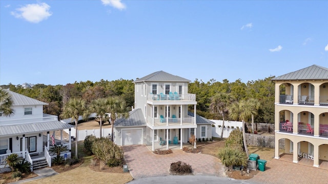 view of front of property featuring a porch and a balcony