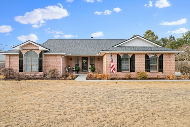 ranch-style home with a front lawn