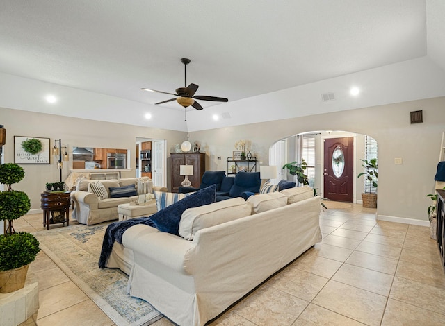 tiled living room with ceiling fan