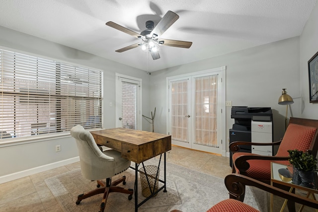 tiled home office with a textured ceiling, french doors, and ceiling fan