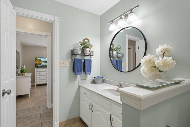 bathroom with tile patterned flooring and vanity