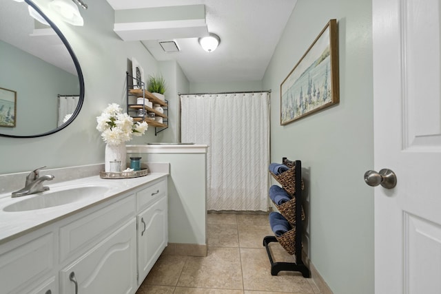 bathroom with vanity and tile patterned flooring