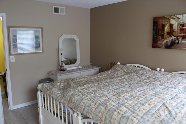 bedroom featuring light tile patterned floors