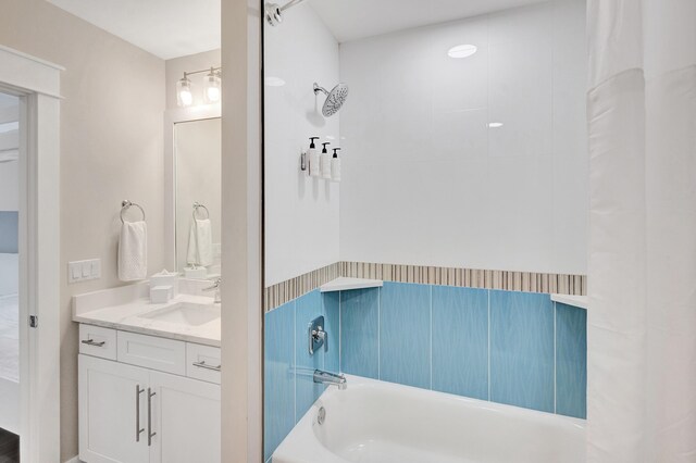 bathroom featuring vanity and shower / bath combo