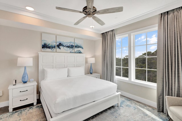 bedroom featuring hardwood / wood-style flooring and ceiling fan